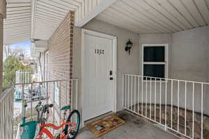 Property entrance featuring stucco siding