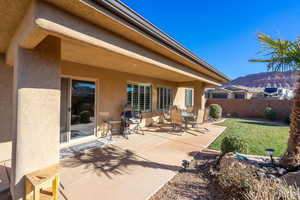 View of patio / terrace featuring fence and a mountain view