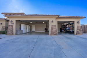 Garage featuring concrete driveway