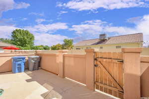 View of patio with a gate