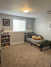 Bedroom with carpet and baseboards