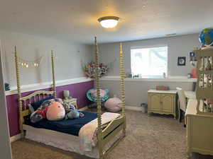 Bedroom featuring light carpet, visible vents, and baseboards