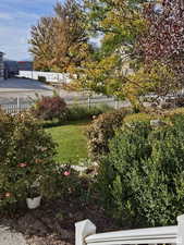 View of yard featuring fence