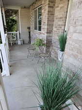 View of patio with covered porch