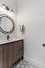 Bathroom with baseboards and vanity