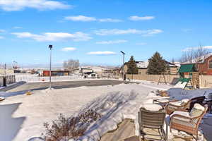 Exterior space with a residential view, fence, and a playground