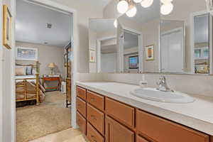 Bathroom with vanity and tile patterned floors