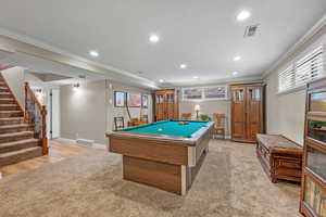 Recreation room featuring recessed lighting, visible vents, crown molding, and baseboards