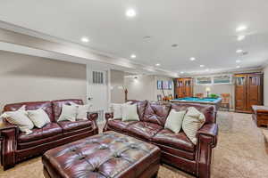 Living room featuring pool table, visible vents, ornamental molding, and recessed lighting