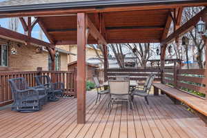 Wooden terrace featuring outdoor dining space