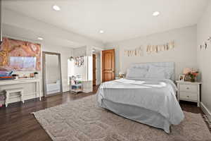 Bedroom featuring baseboards, dark wood-type flooring, and recessed lighting