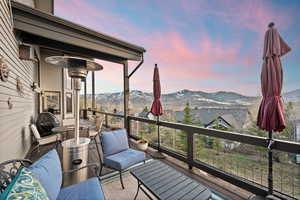 Wooden terrace featuring a mountain view