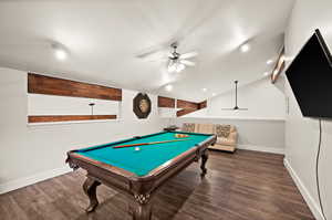 Game room with lofted ceiling, pool table, baseboards, and wood finished floors