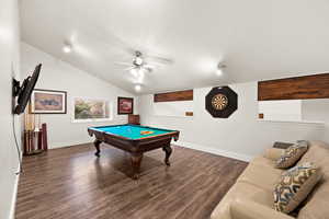 Game room featuring baseboards, vaulted ceiling, dark wood-type flooring, and pool table