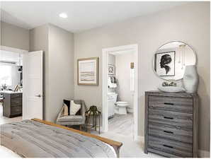 Bedroom with recessed lighting, baseboards, and ensuite bathroom