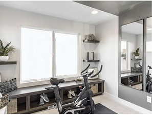 Exercise area featuring recessed lighting and baseboards