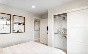 Bedroom featuring a closet and baseboards