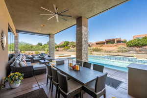 View of patio / terrace featuring a fenced in pool, an outdoor hangout area, an in ground hot tub, fence, and outdoor dining area