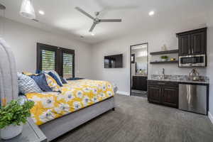 Bedroom featuring wet bar, visible vents, baseboards, and recessed lighting