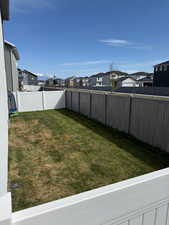 View of yard with a residential view and a fenced backyard