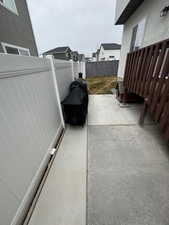 View of patio with a fenced backyard