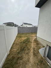 View of yard featuring a fenced backyard