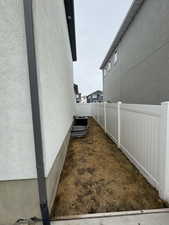 View of home's exterior with a fenced backyard and stucco siding