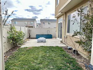 View of yard featuring a patio area and a fenced backyard