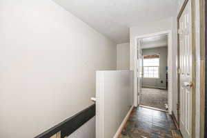 Upstairs landing, facing bedroom two. Shows doorway to full bath.