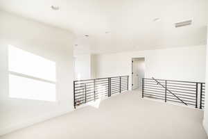 Hall with recessed lighting, light carpet, an upstairs landing, baseboards, and visible vents