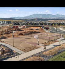 View of basketball court with community basketball court, a residential view, and a mountain view