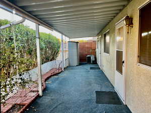 View of patio / terrace with central AC and fence