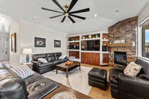 Living area featuring ceiling fan, a fireplace, visible vents, and recessed lighting