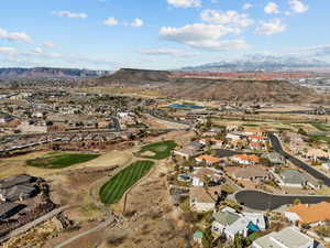 Aerial view with view of golf course, a residential view, and a mountain view