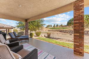 View of patio with a fenced backyard