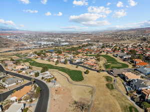 Drone / aerial view with view of golf course and a residential view