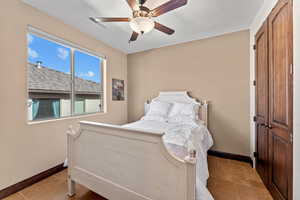 Bedroom featuring visible vents, ceiling fan, and baseboards