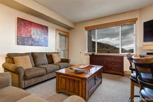 Living room featuring light carpet