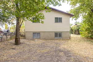 View of home's exterior with fence