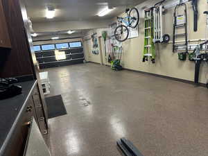 Garage featuring baseboards