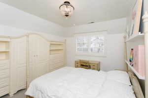 Bedroom featuring visible vents