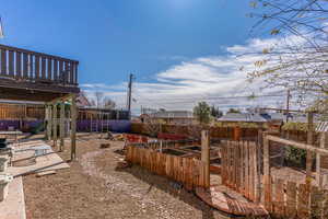 View of yard with a fenced backyard and a vegetable garden