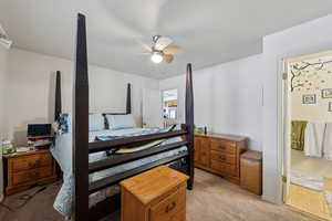 Bedroom featuring light carpet and a ceiling fan