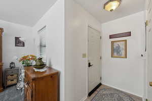 Foyer featuring baseboards