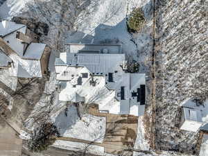 Snowy aerial view with a residential view