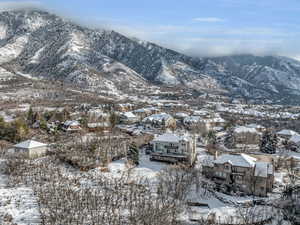 Property view of mountains with a residential view