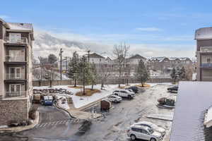 Surrounding community with uncovered parking and a residential view