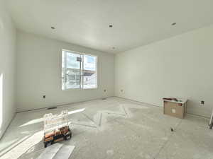 Unfurnished room with visible vents and a textured ceiling