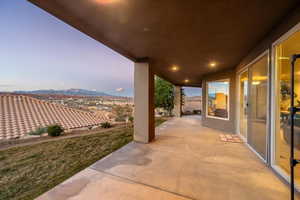 Patio terrace at dusk with a mountain view