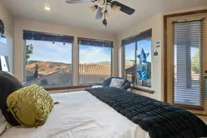 Bedroom featuring a mountain view, recessed lighting, a ceiling fan, and access to exterior